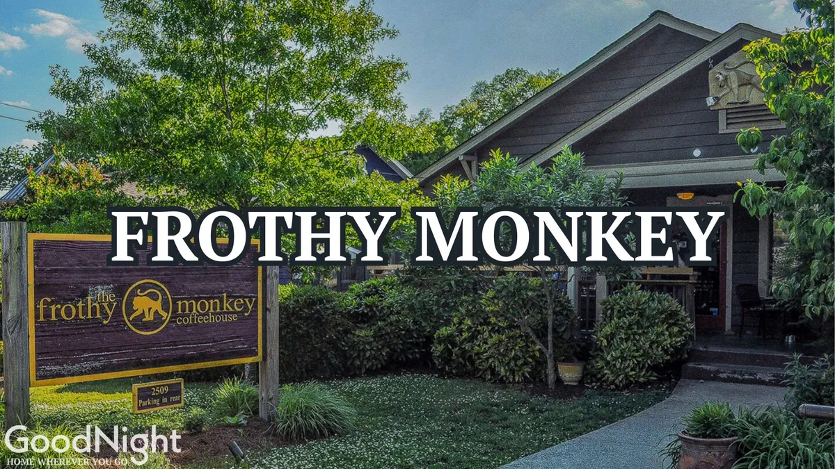 The exterior of Frothy Monkey, a popular local coffee spot, featuring its recognizable signage, welcoming architecture, and surrounding greenery. The scene suggests a relaxed, friendly place perfect for a morning coffee or casual meet-up.